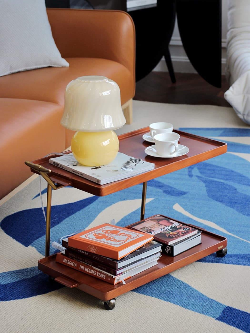 Styled furniture setting with coffee table and warm interior details